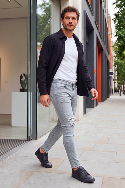 Jeans da uomo grigio marmo attillati lavati e strappati