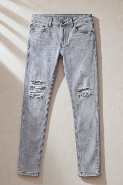 Jeans da uomo grigio marmo attillati lavati e strappati