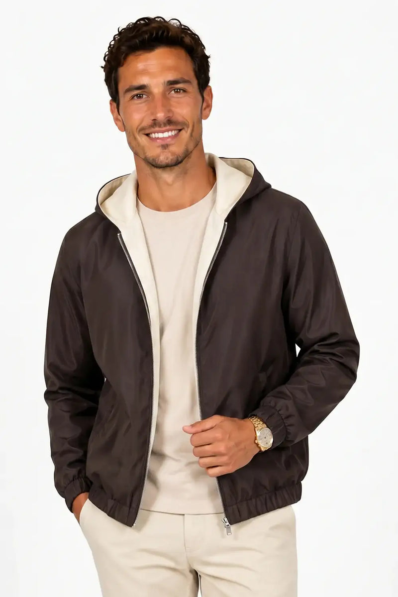 Man wearing stylish brown hooded bomber jacket with cream chinos, perfect for casual fashion