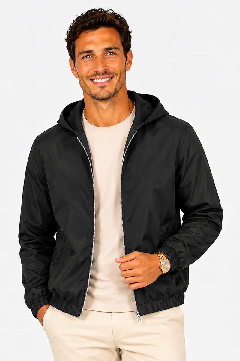 Man wearing black hooded bomber jacket with beige chinos, stylish casual outfit for everyday wear