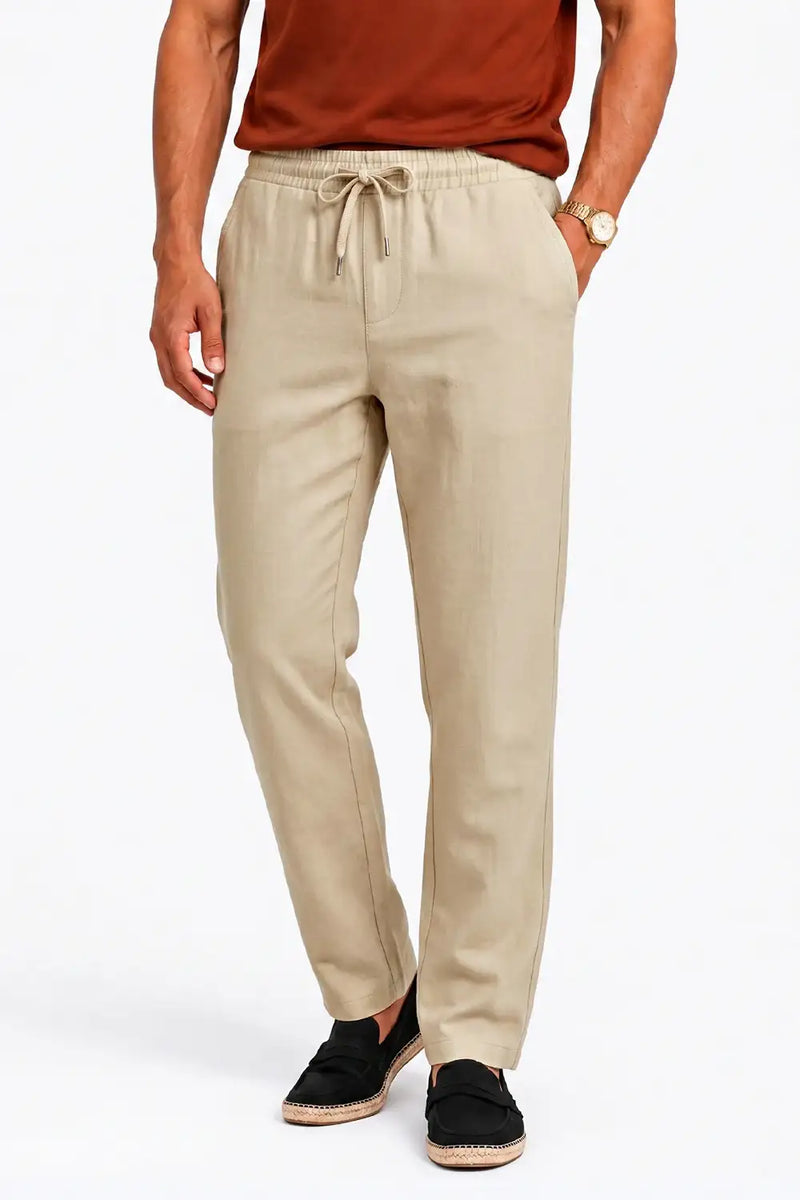 Beige drawstring chinos for men, relaxed fit, paired with espadrilles and rust tee, ideal for casual comfort.