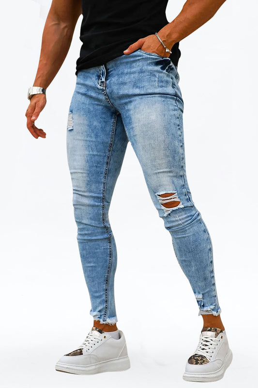 Jeans skinny azzurri strappati al ginocchio da uomo
