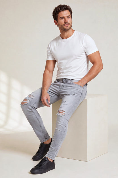 Jeans da uomo grigio marmo attillati lavati e strappati