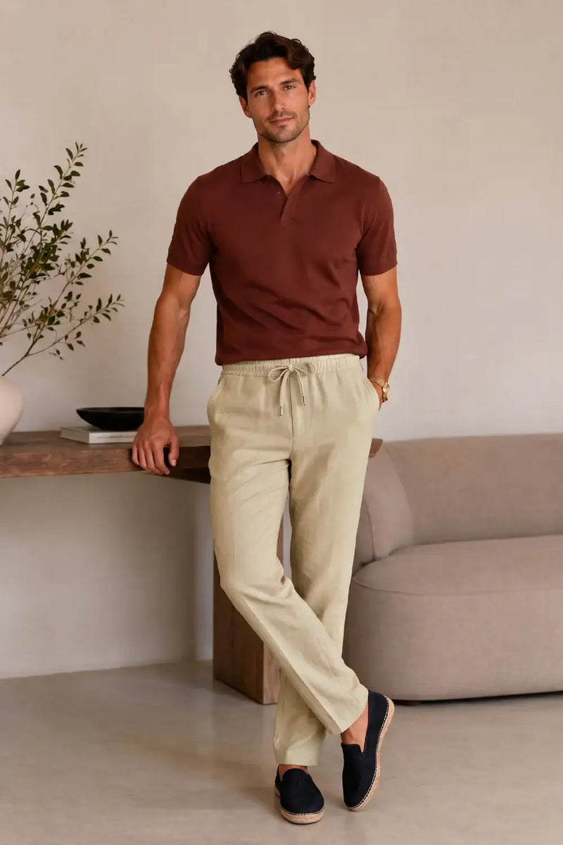 Man wearing beige drawstring chinos with brown polo shirt, styled for casual comfort and fashion