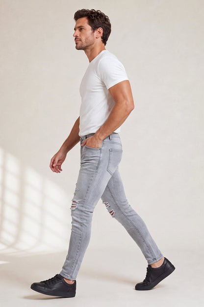 Jeans da uomo grigio marmo attillati lavati e strappati