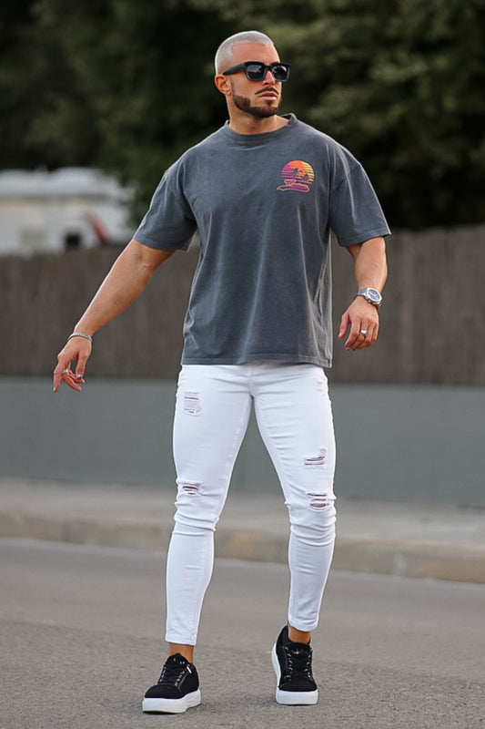 Jeans da uomo bianchi strappati elasticizzati